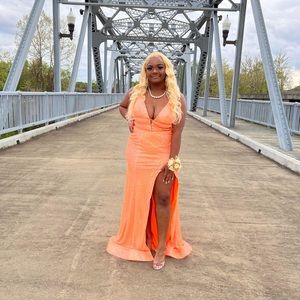 Prom dress for sale , the color is orange . size 8 .